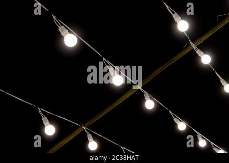LED Lamp String on Black Night Scene Background. LED light on black background Stock Photo