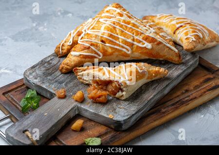 Puff pastry turns with apple filling. Stock Photo