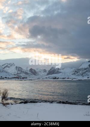 A portrait shot of a sunrise over a Norwegian fjord Stock Photo