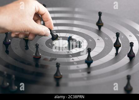 Hand moving pawn on a conceptual target to win the first place. Composite image between a hand photography and a 3D background. Stock Photo