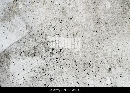 Background grey concrete surface of wall with old paint and scratches Stock Photo