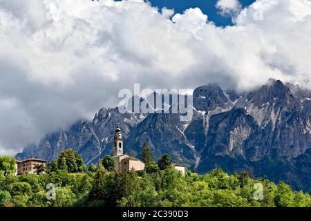 The village of Parrocchia and in the background Mount Carega of the Piccole Dolomiti. Vallarsa, Trento province, Trentino Alto-Adige, Italy, Europe. Stock Photo