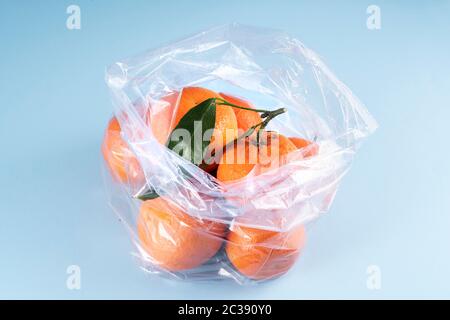 Some tangerines in a plastic bag Stock Photo