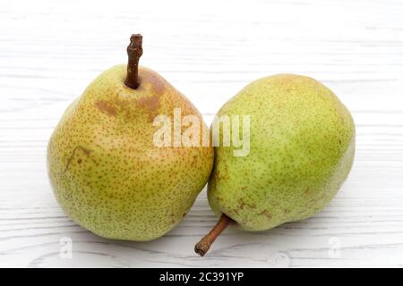 Green ripe pear on a white table background. in studio shot Stock Photo