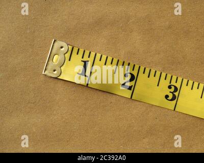 Yellow flexible tape measure Stock Photo - Alamy