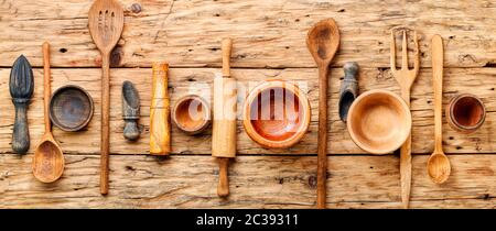 Concept of wooden rustic kitchenware utensils set on old background Stock Photo