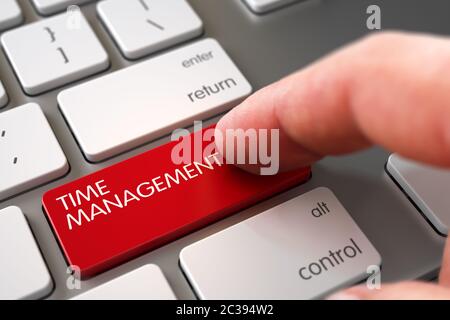 Hand Pushing Time Management Red Laptop Keyboard Keypad. Selective Focus on the Time Management Button. Finger Pushing Time Management Button on Moder Stock Photo