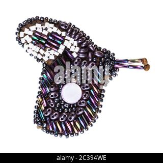handcrafted butterfly brooch from glass rainbow bugles and various beads isolated on white background Stock Photo