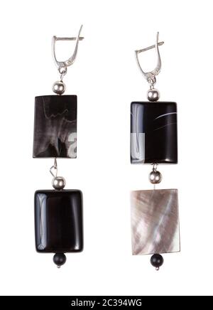 top view of hand crafted silver earrings from polished agate and nacre beads isolated on white background Stock Photo