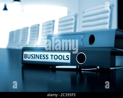 Business Tools - Office Binder on Wooden Desktop. Business Tools - Business Concept on Toned Background. Business Tools Concept. Toned Image. 3D Rende Stock Photo
