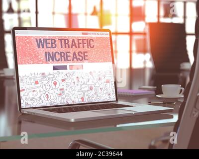 Web Traffic Increase Concept. Closeup Landing Page on Laptop Screen in Doodle Design Style. On Background of Comfortable Working Place in Modern Offic Stock Photo