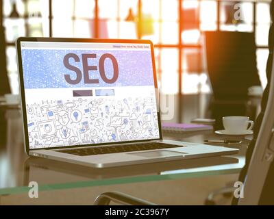SEO - Search Engine Optimization - Concept - Closeup on Landing Page of Laptop Screen in Modern Office Workplace. Toned Image with Selective Focus. 3D Stock Photo