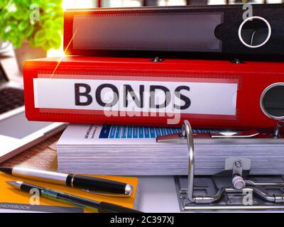 Red Office Folder with Inscription Bonds on Office Desktop with Office Supplies and Modern Laptop. Bonds Business Concept on Blurred Background. Bonds Stock Photo