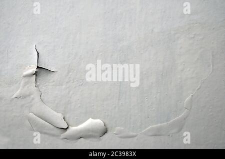 Industrial textured concrete background, white peeling paint on an old grungy wooden surface. Stock Photo