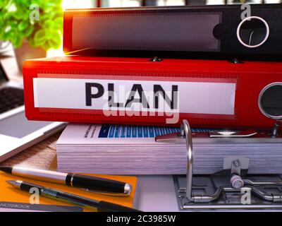 Plan - Red Office Folder on Background of Working Table with Stationery and Laptop. Plan Business Concept on Blurred Background. Plan Toned Image. 3D. Stock Photo