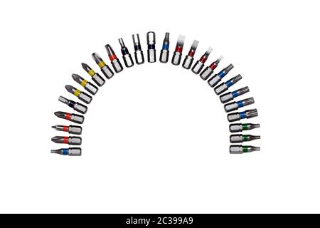 Collection of tools. Closeup of different screwdriver bits arranged in a half round isolated on a white background. Macro of metallic interchsngeable Stock Photo