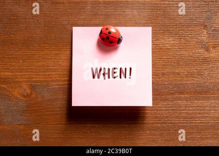 a colored memo sheet with writing  when Stock Photo