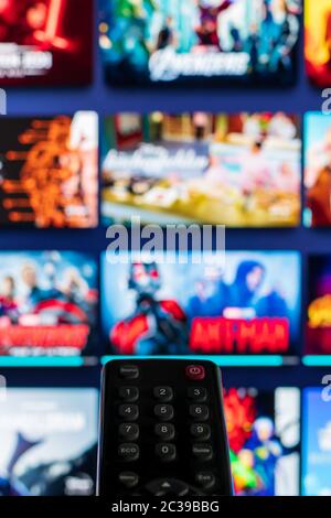 Video on demand screen with remote control in the foreground Stock Photo