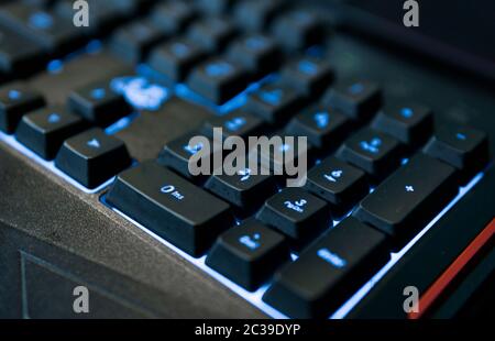 Computer keyboard green illuminated with euro symbol. News Photo - Getty  Images