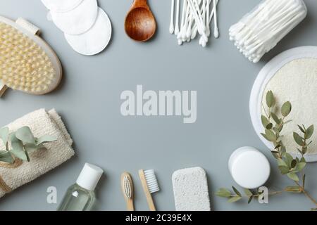 ecological beauty care products on a gray background. Bamboo toothbrush towel, earbuds Stock Photo