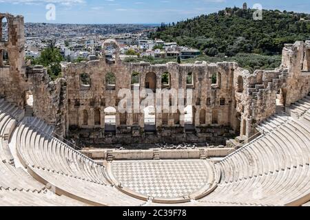 Herodes Atticus Odeon, Herodium ancient theater under the ruins of Acropolis, Greece, overlooking Athens city, sunny spring day, blue sky Stock Photo