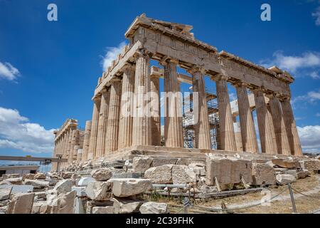 Athens Acropolis, Greece. Parthenon temple facade side view, ancient temple ruins, blue sky background in spring sunny day. Stock Photo