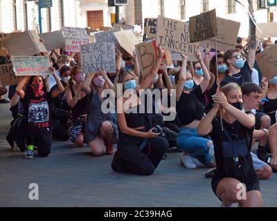 At a BLM rally in Brighton protesters take the knee Stock Photo