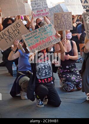 At a BLM rally in Brighton protesters take the knee Stock Photo