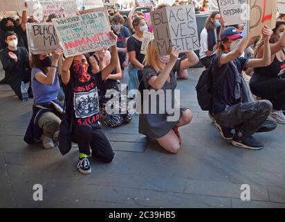 At a BLM rally in Brighton protesters take the knee Stock Photo