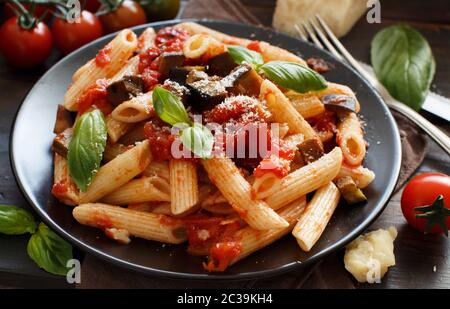 Penne alla norma  - traditional italian pasta with eggplants and tomatoes Stock Photo