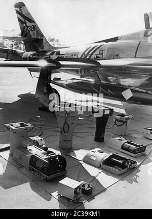 A reconnaissance plane of the brand Republic, model RF-84F Thunderflash from the 50s. It was used for aerial reconnaissance and was able to take many sharp pictures due to its modern equipment and cameras (in the foreground). Stock Photo