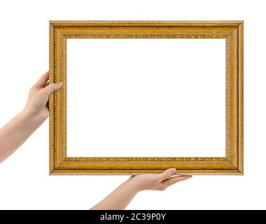 Wooden picture frame in hands Stock Photo