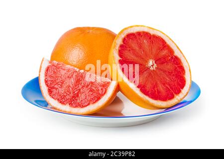 Ripe grapefruits on blue plate Stock Photo