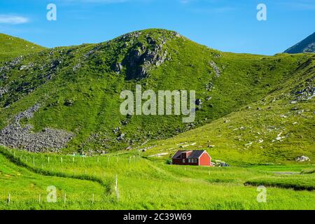 Mountains and farmstead on the Lofoten islands in Norway. Stock Photo