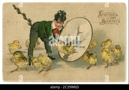 Russian Empire historical postcard: Christian Easter, 'Christ is Risen', a Man in a suit with a willow in his pocket leads a dance of chickens. 1914 Stock Photo