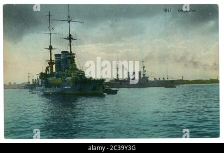 German historical postcard: Warships in the port of Kiel. Colorized photo, world war one 1914-1918. German empire Stock Photo