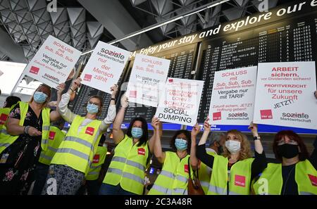 19 June 2020, Hessen, Frankfurt/Main: Employees LSG hold up posters during a protest action by air traffic employees in Terminal 1 of Frankfurt Airport. The Verdi union has called for a nationwide demonstration to draw attention to the situation of ground handling employees. Photo: Arne Dedert/dpa Stock Photo