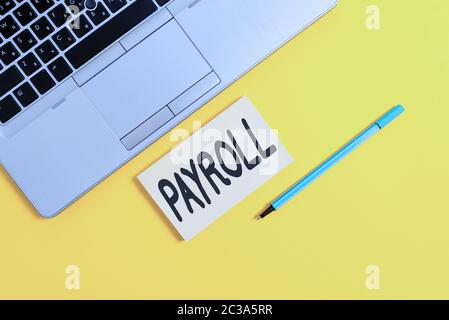 Handwriting text writing Payroll. Conceptual photo total of all compensation business must pay to its employees Trendy silver open laptop square stick Stock Photo