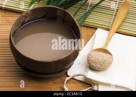 Kava drink made from the roots of the kava plant mixed with water Stock Photo