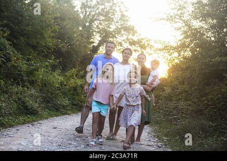 Portrait of the big happy family. Parents with children in countryside Stock Photo