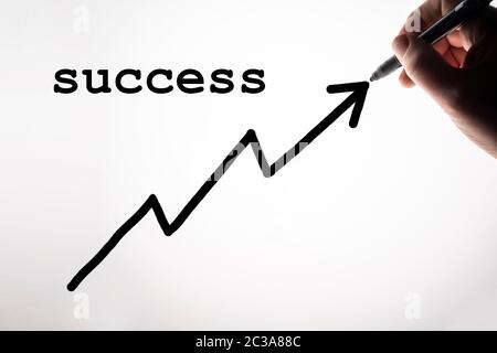 the success graph drawn on a backlit surface Stock Photo