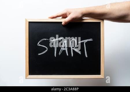 the word start written on a blackboard Stock Photo