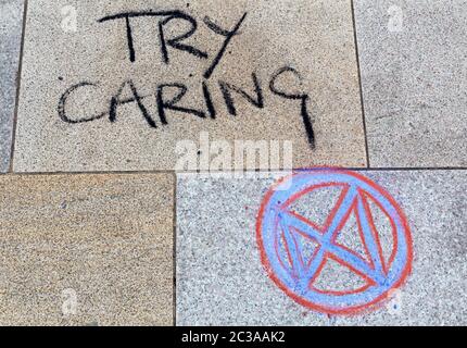 Chalk graffiti in the Town Square in Weston-super-Mare, UK as part of a protest organised by Extinction Rebellion Weston-super-Mare on 22 April 2019. Stock Photo