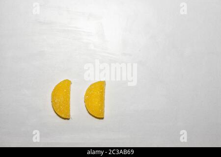 Two Sugar candies shaped as half moon. Stock Photo