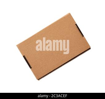 closed rectangular small brown box for transporting goods isolated on a white background, top view. Blank cardboard storage box Stock Photo