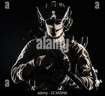 Elite commando fighter, private military company mercenary, special operations serviceman, security or secret service shooter equipped modern weapons Stock Photo