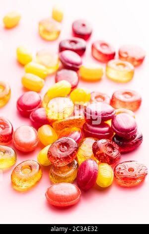 Sweet colorful candies on pink background. Stock Photo