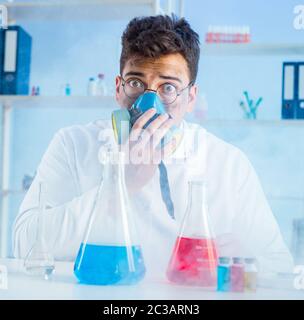 Funny mad chemist working in a laboratory Stock Photo