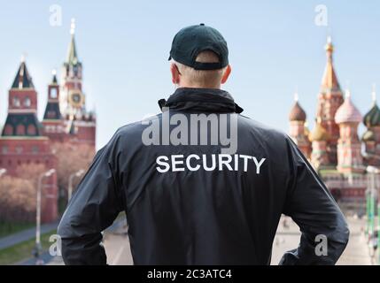 Security Man Looking At Moscow Kremlin On The Red Square In Moscow Stock Photo