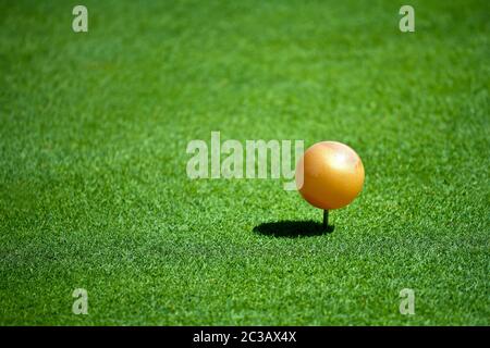 A Close up View of a Gold Tee Marker on a Golf Course on a Sunny Day. n. Stock Photo